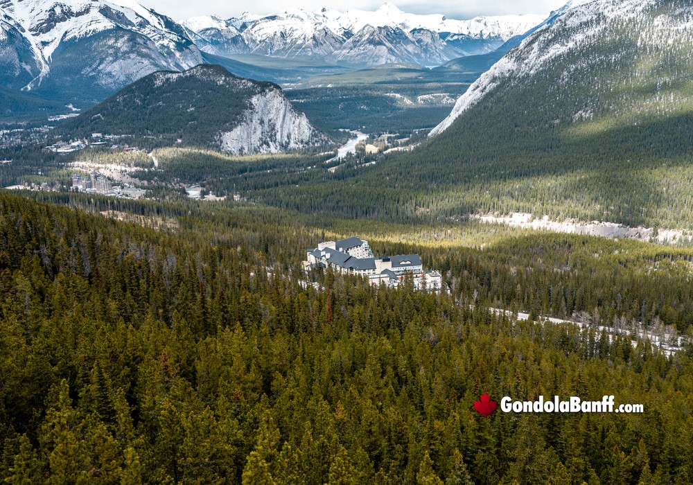 Fairmont Banff in Forest Mountains Aerial View