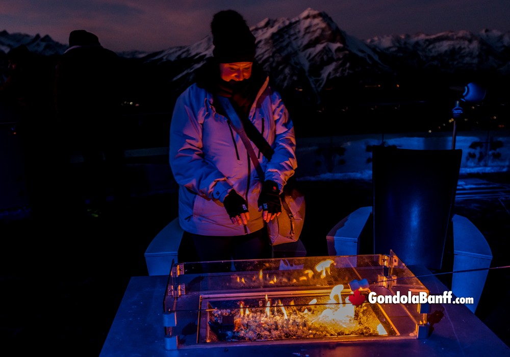 Keeping Warm by a Patio Fire at the Gondola Nightrise